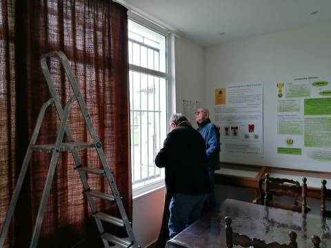 Installing curtains in the classroom