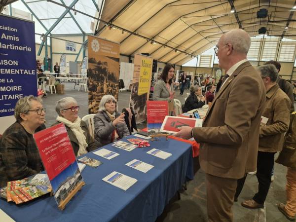 Our three volunteers in deep discussion with Marc Fleuret, President of the Departmental Council